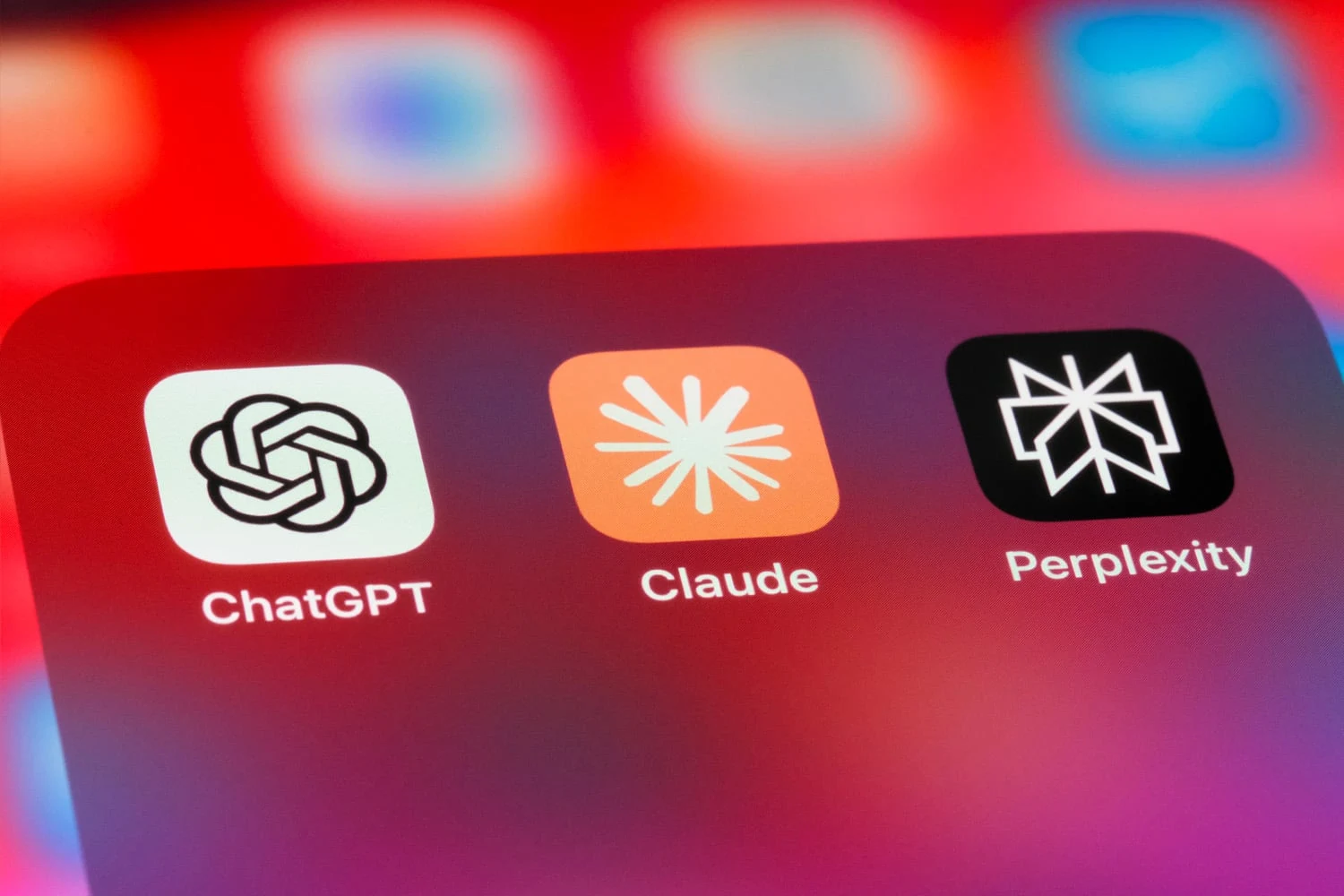 Best AI app for iPhone, the ChatGPT, Claude and Perplexity icons on an iPhone screen