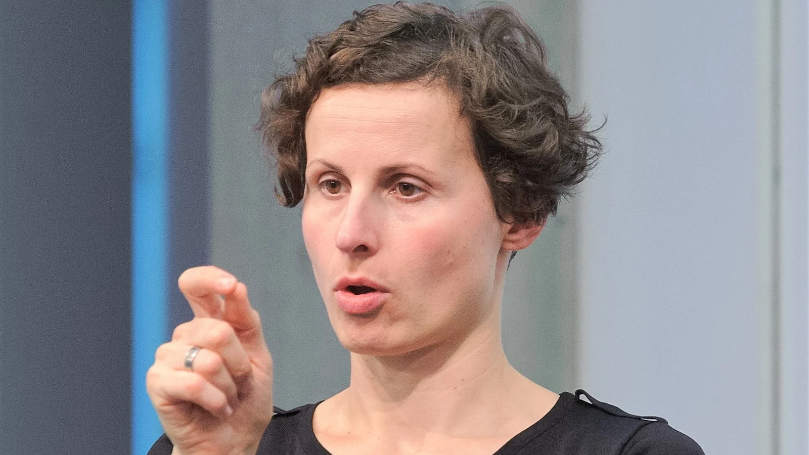 Sign language interpreter mid sign during a live event
