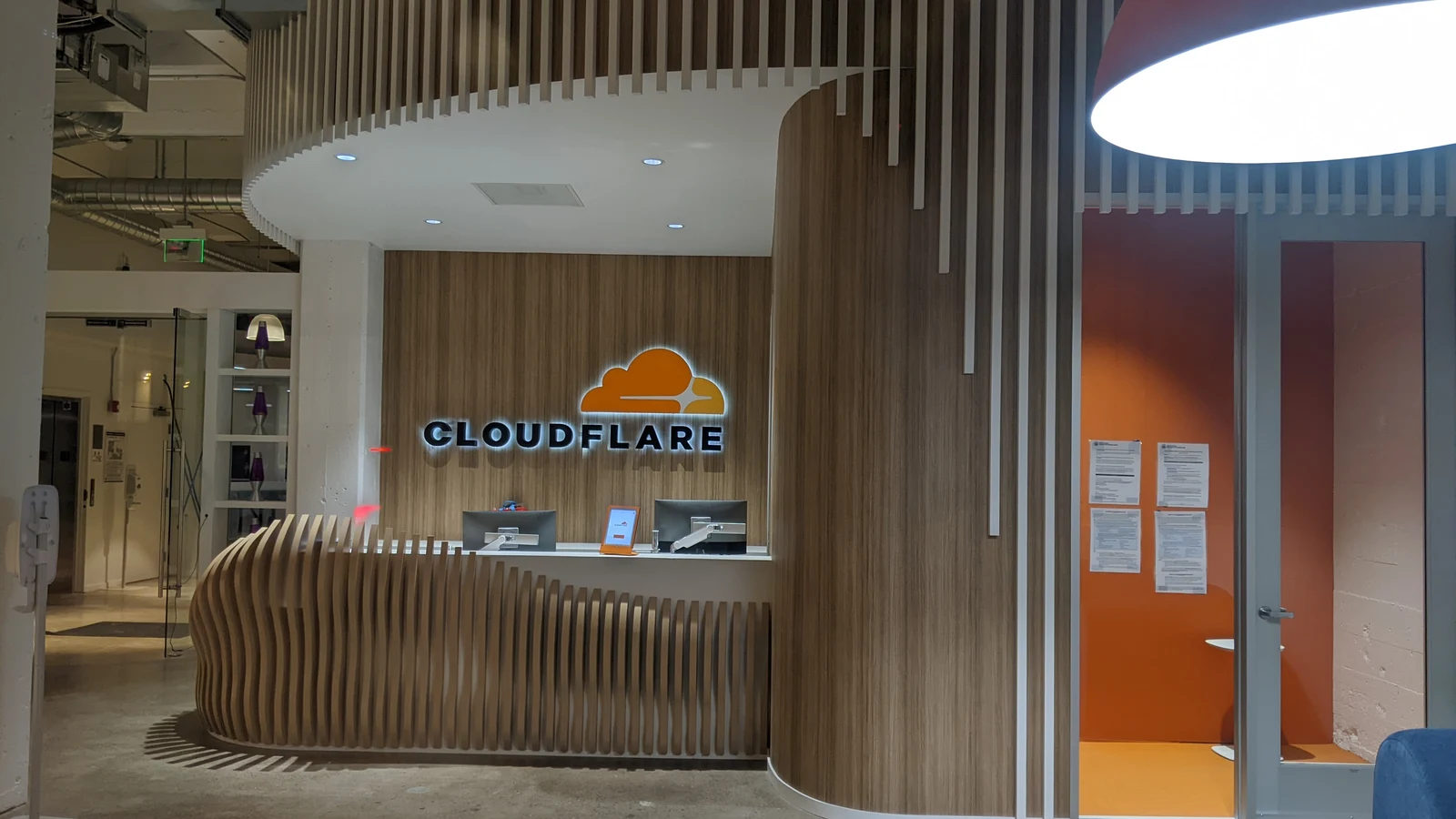 The Cloudflare logo on the wall of the company's office entrance, where the Clef decision models were built
