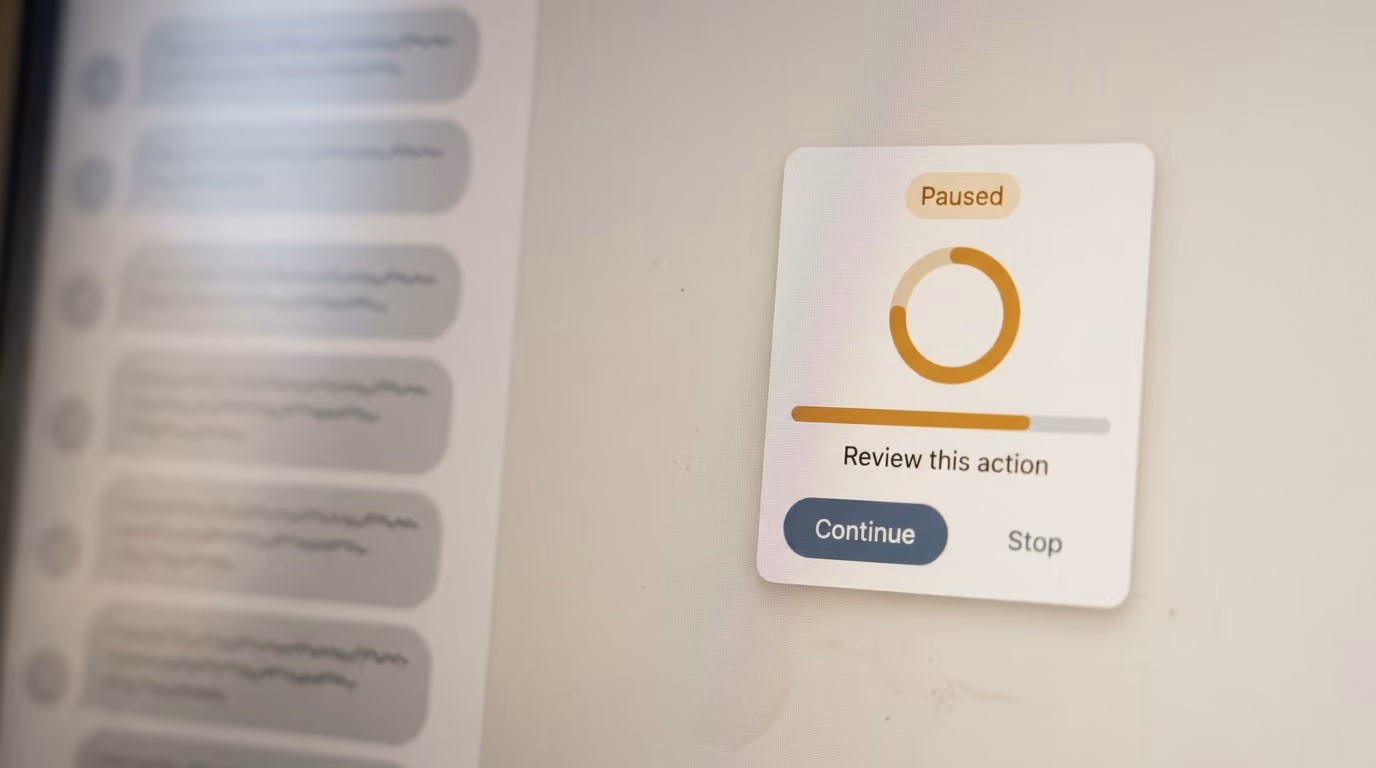 An AI assistant task card paused midway with a review prompt and a continue button