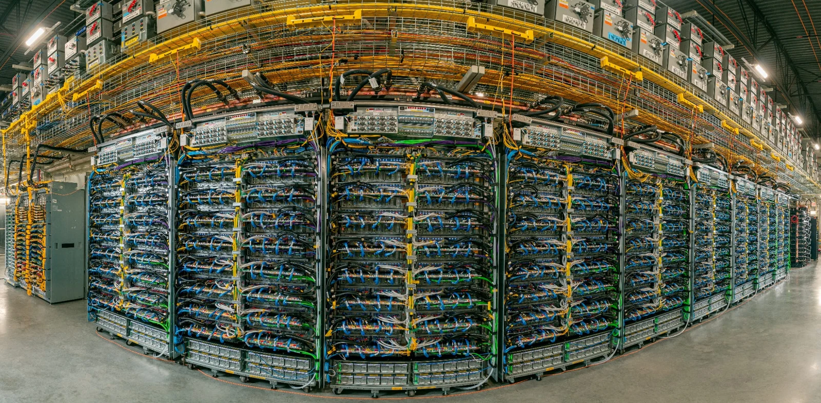 Rows of Google TPU racks in a data center, an alternative to Nvidia GPUs for AI